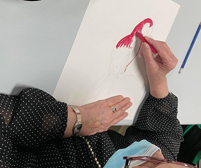 adult drawing in class